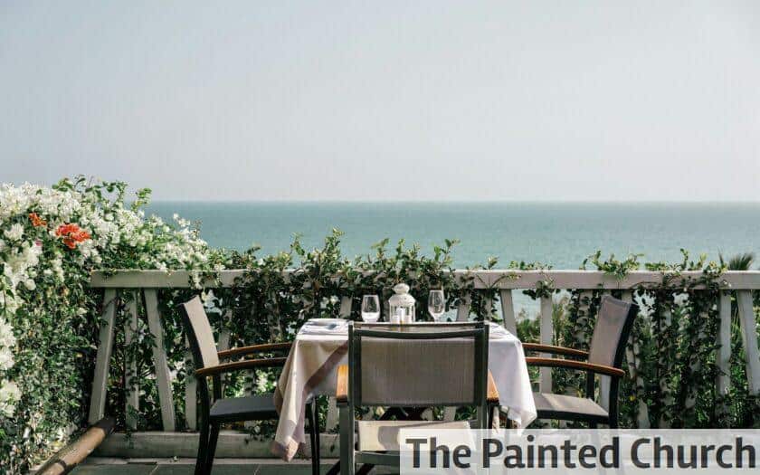 white table and chairs on a sunny day