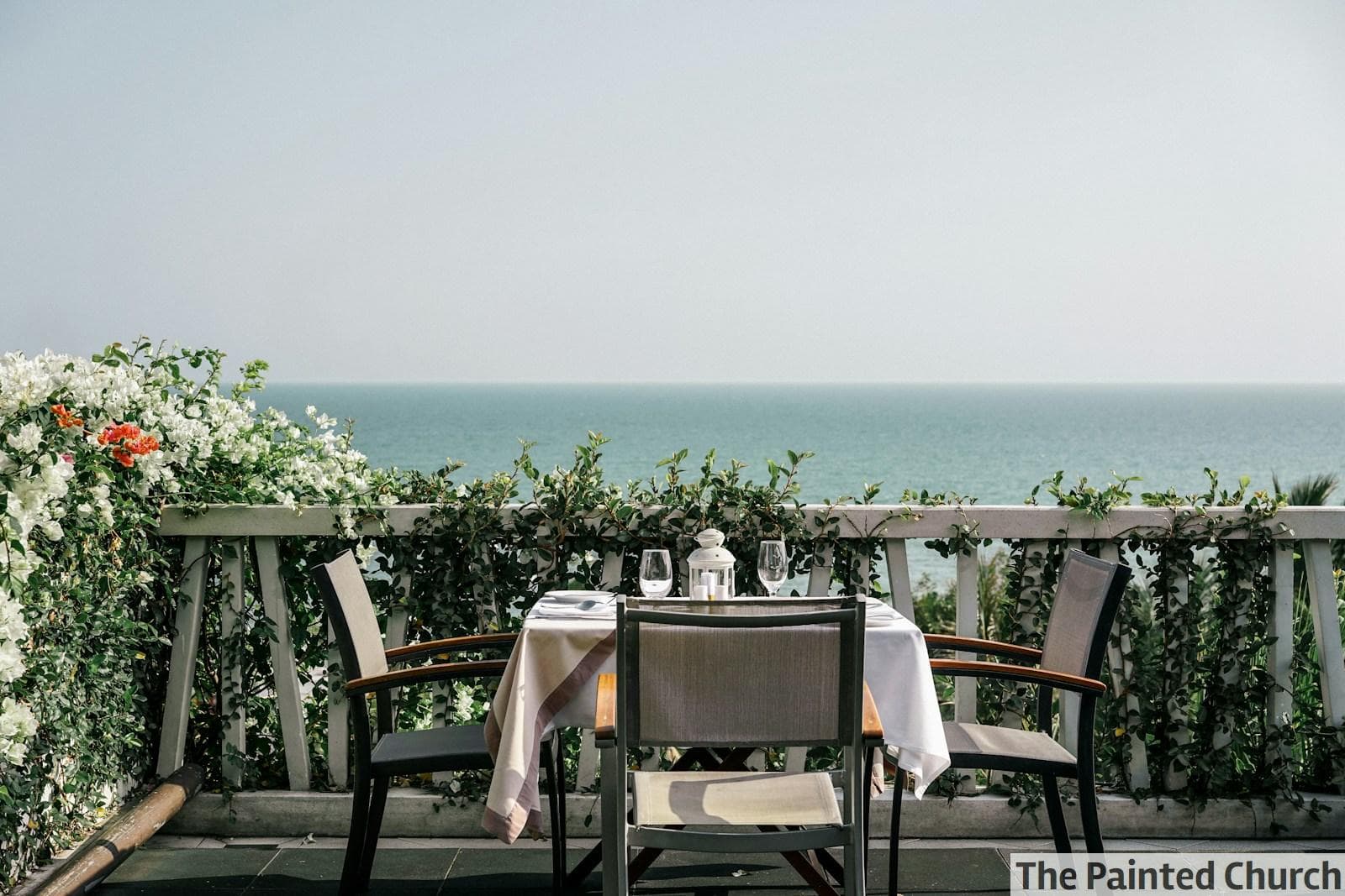 white table and chairs on a sunny day